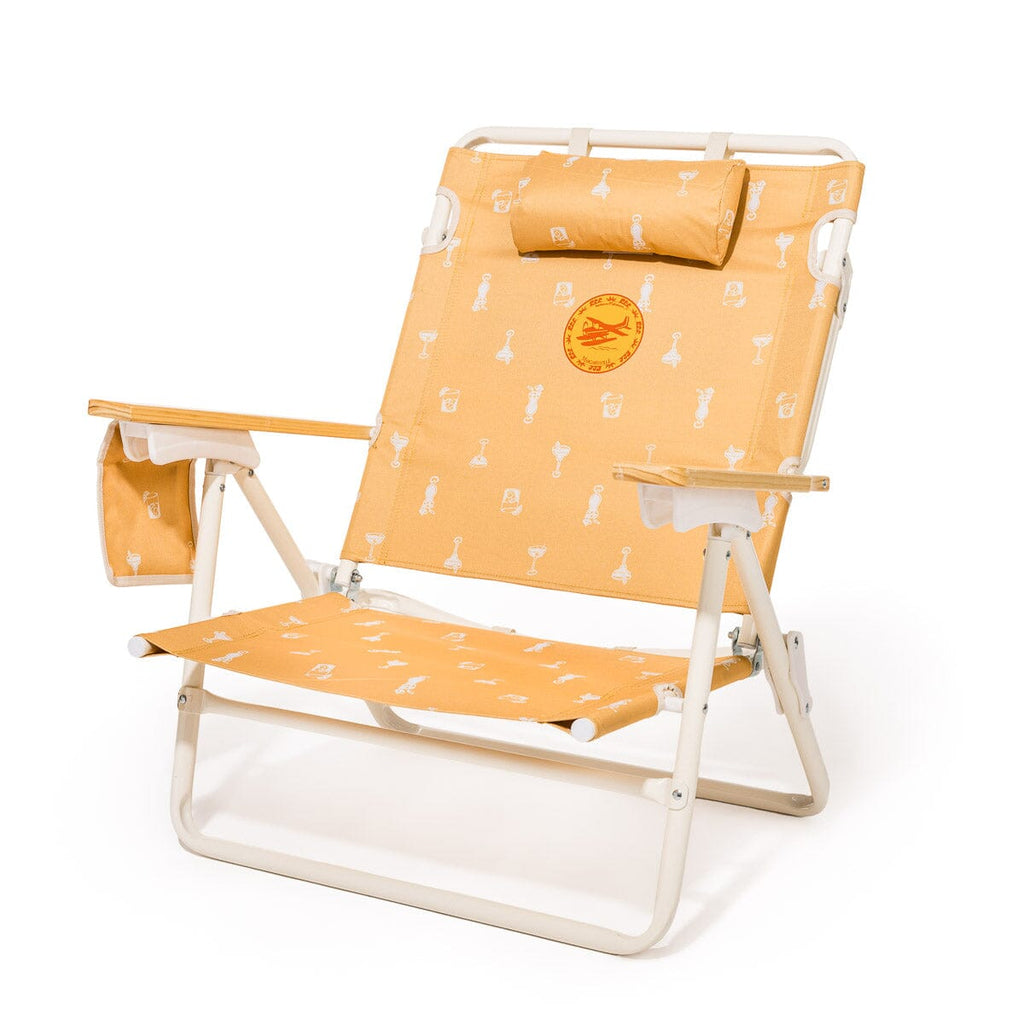 Foldable beach chair with orange patterned seat and backrest on a white background